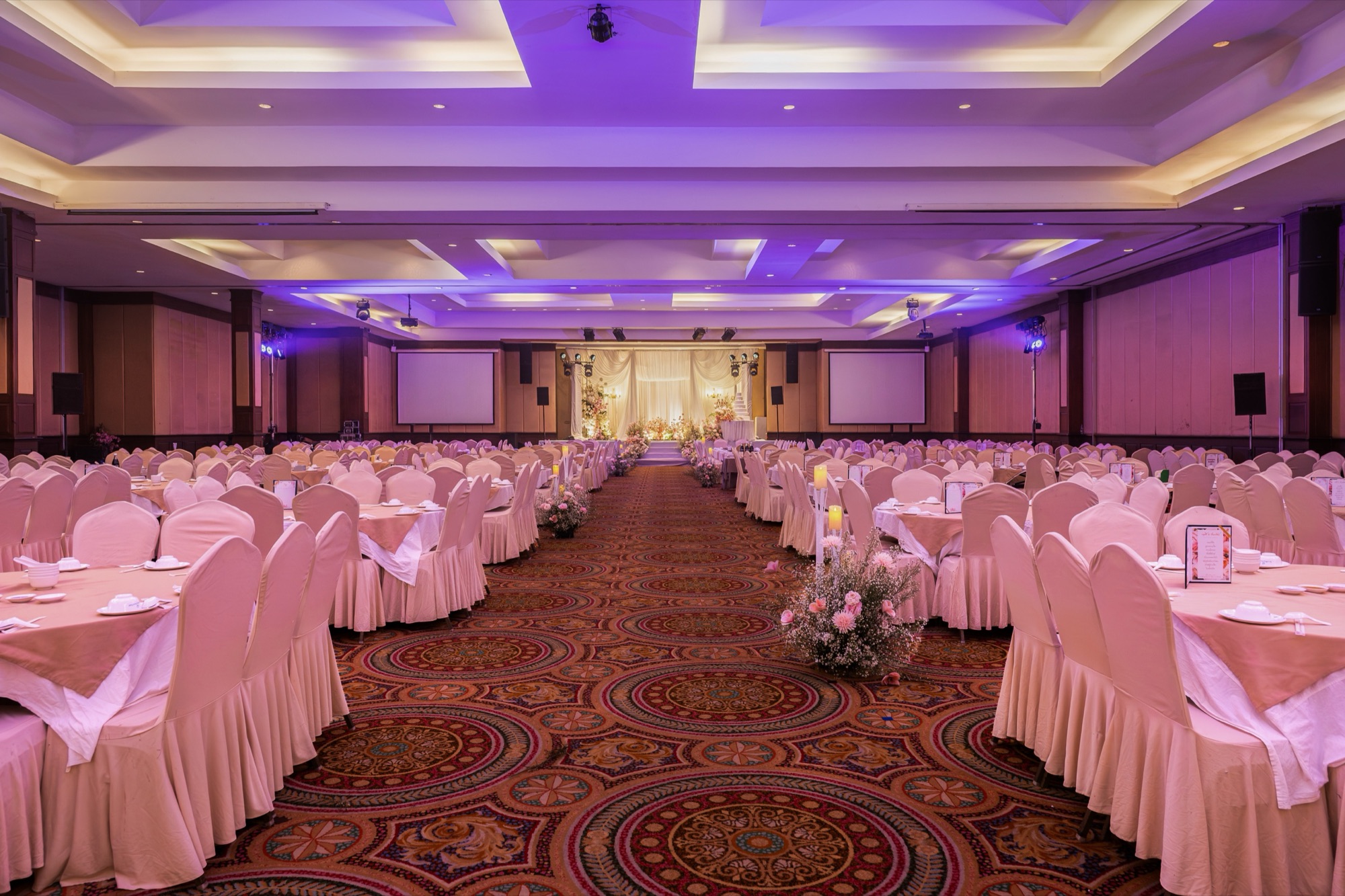 The Grand Ballroom banquet hall with violet ambient lighting for group dining at Sri U-Thong Grand Hotel